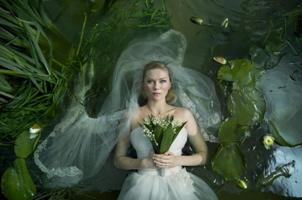 Lars+von+Triers+newest+film%2C+Melacnholia%2C+tells+the+story+of+the+end+of+two+worlds+through+the+imagination+of+new+bride%2C+Justine+%28Kirsten+Dunst%29.+The+film+will+premier+at+the+New+York+Film+Festival+on+Oct.3+and+Oct.6.+%28Courtesy+of+Melancholiafilm.com%29
