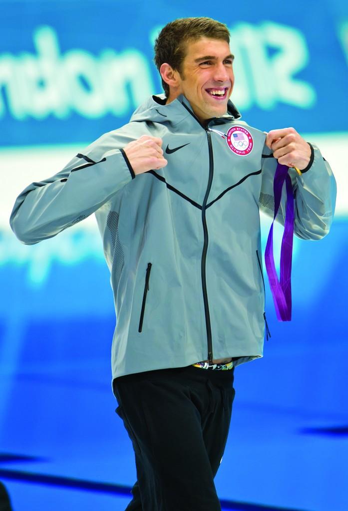 Phelps+stands+triumphant+at+the+London+games+shortly+after+winning+his+record+22nd+medal.+%28David+Eulitt%2FKansas+City+Star%2FMCT%29%0D%0A