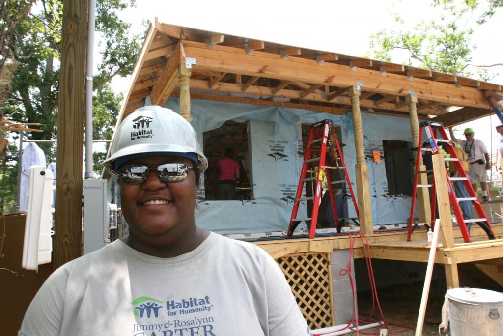 Angel Lewis stands in front of the new home being built by volunteers during Habitat for Humanitys Jimmy & Rosalynn Carter Work Project in the Forest Heights subdivision in Gulfport, Mississippi, Tuesday, May 13, 2008. (James Edward Bates/Biloxi Sun-Herald/MCT)