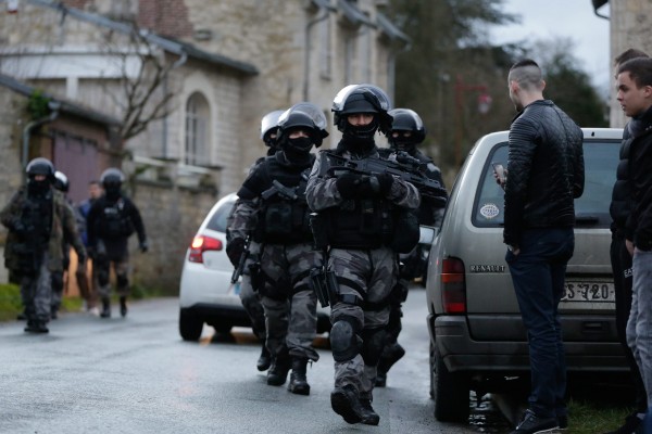 On January 8, 2015, French police officers search for the two gunmen involved in the shooting that occurred at the Charlie Hebdo headquarters. (Arnaud Dumontier/Maxppp/Zuma Press/TNS)