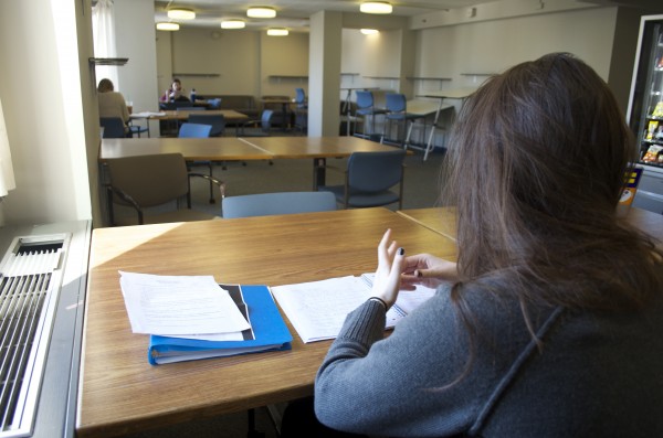 A student works hard in one of the study lounges in McMahon Hall. (Paula Madero/The Observer)
