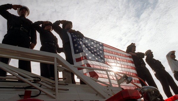 Firefighters salute to the flag in Richmond, CA. (Scott Vlha/ Contra Costa Times)