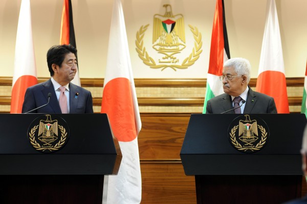 Japanese Prime Minister Shinzo Abe met with Palestinian President Mahmoud Abbas to demand that the Islamic State release two hostages. (Thaer Ganaim/APA Images/Zuma Press/TNS)