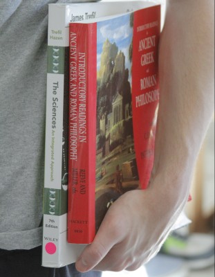 A double major means double the books. (Photo illustration by JUSTIN REBOLLO/THE OBSERVER)