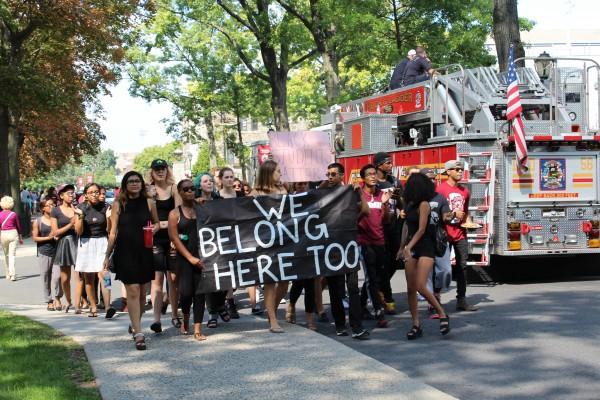 The group of students marched down Constitution Row, the road intersecting Coffey Field and the homecoming tent set up on Edward's Parade (CONNOR MANNION/THE OBSERVER)