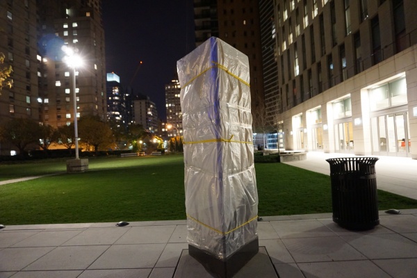 The plinth that serves as a monument to Robert Moses is currently covered up, due to debates about its position on campus (PHOTO BY HANA KENNINGHAM/OBSERVER ARCHIVES)