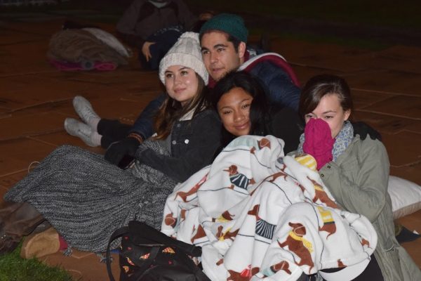 Students bundle up on mats of cardboard to sleep overnight on the plaza. (JON BJORNSON JR/THE FORDHAM OBSERVER)