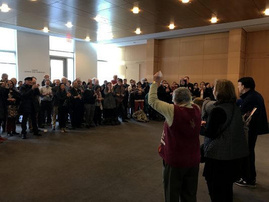 Over+100+faculty+members+holding+a+silent+protest+over+statutes+violations+outside+of+the+Board+of+Trustees+lunch+in+the+Bateman+Room+of+the+Fordham+Law+building.