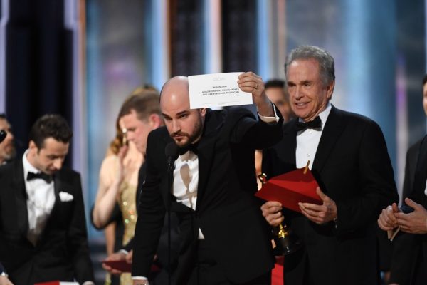 Jordan Horowitz holds up the Best Picture card for Moonlight. (OSCARS/GETTY IMAGES)