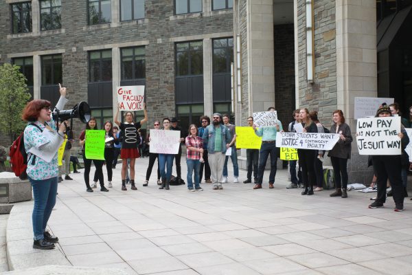 Students express their support for adjunct faculty members at a Rose Hill Campus  protest. (EMMA DIMARCO/The Observer)