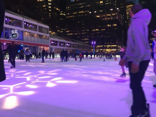 Skaters relax at the ice rink at Bryant Park. (COURTNEY BROGLE/THE OBSERVER)