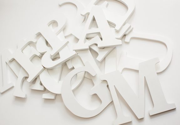 assorted+jumbled+wooden+letters+on+white