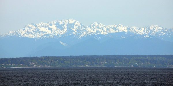 The Olympic mountains above Puget Sound, Russell’s picturesque view from his commandeered plane.