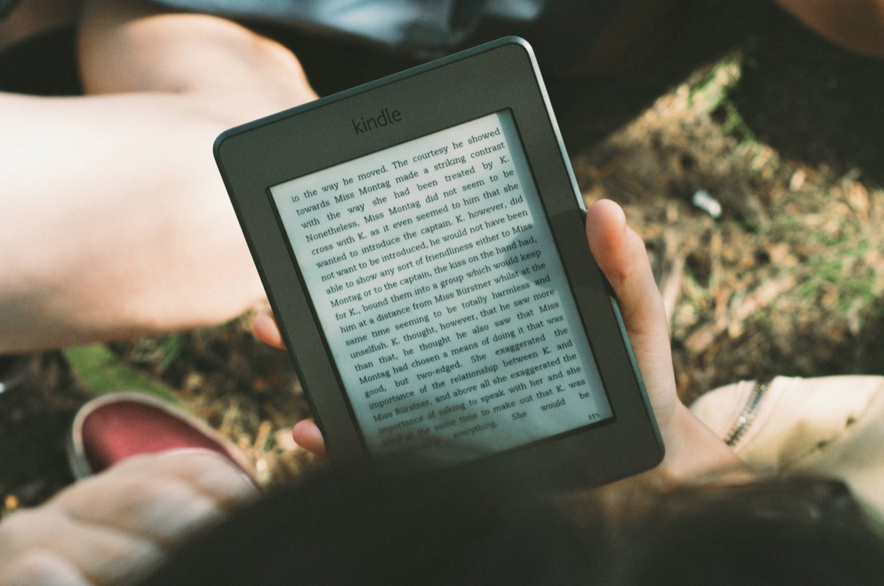 Use technology to your advantage when trying to fit reading into a busy schedule by downloading e-books (via PxHere).