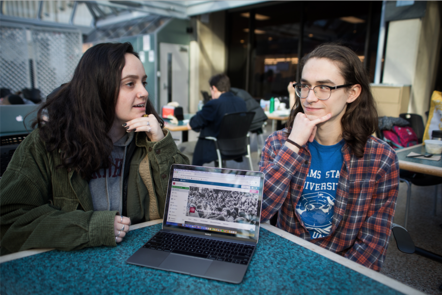 SAGES members Margaret Cohen, FCLC 20 (left), and Connor Sick, FCLC 18 and GSS 19 (right), discuss the collective nature of the website which ensures transparency in the Fordham community. (ZOEY LIU/THE OBSERVER)