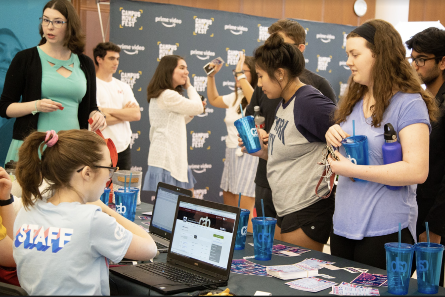 Students collect some CAB swag before the screenings.