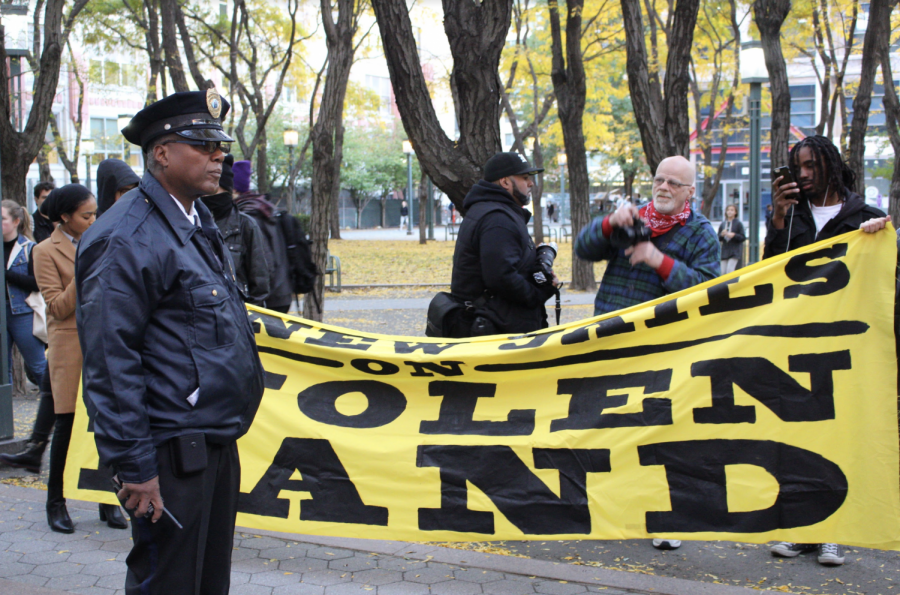 NYPD officer at emergency action protest on Nov. 1.