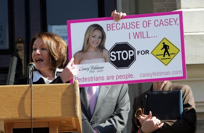 Diane Anderson holds up her daughter's image to fight for a new pedestrian safety law in New Jersey. The law was passed on April 1, 2010.