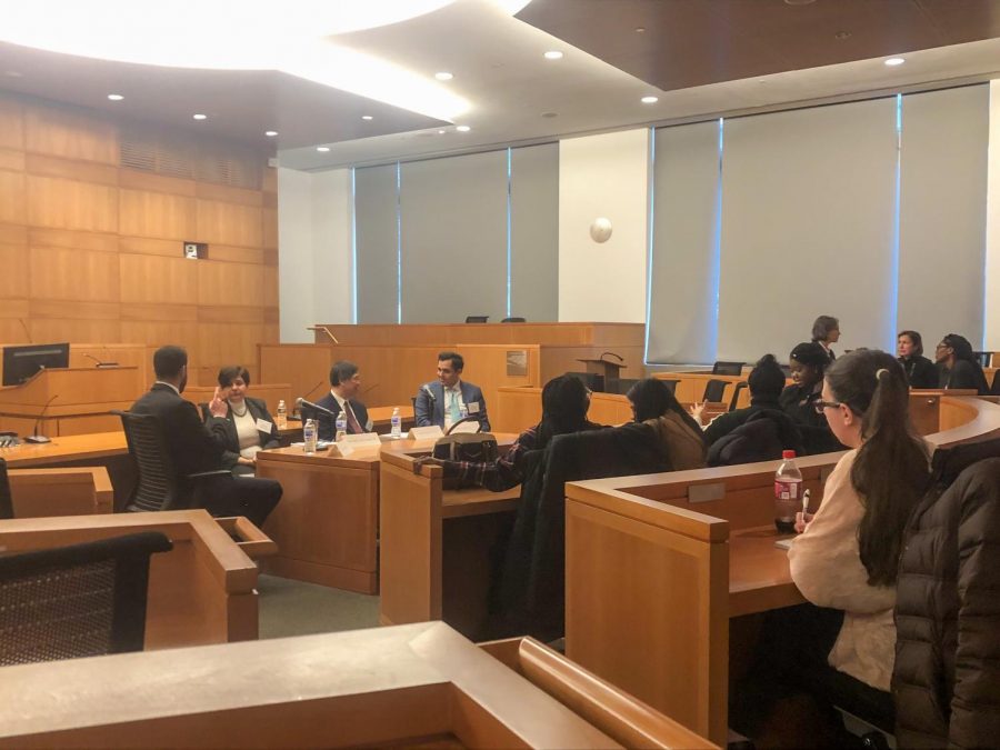 The Honorable Maria Araujo Kahn 89 (center-left) and Denny Chin 78 (center-right) share their experiences before an audience of first-generation students and alumni in the Gorman Moot Courtroom.