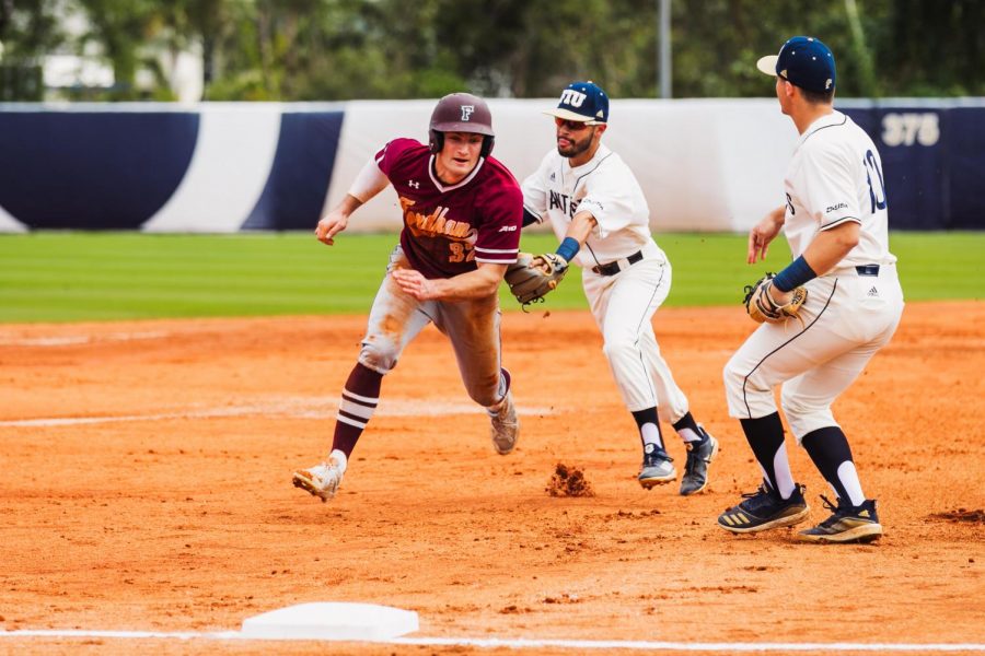 Billy Godrick, FCRH 20, unsuccessfully tries to advance to third base in Fordhams third game against FIU.