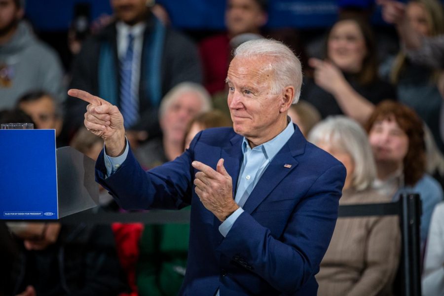 Former+Vice+President+Joseph+Biden+looks+to+his+right+and+points+both+fingers+to+the+crowd