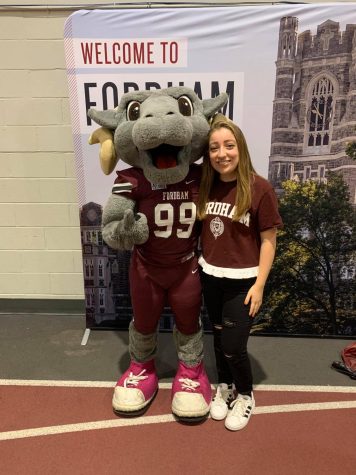 Bella Sabino posing with Ramses, the Fordham mascot