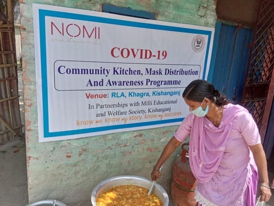 A woman serves food as part of the Nomi Network response in India
