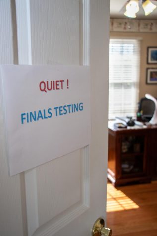 a bedroom door with a sign reading "Quiet! Finals Testing"