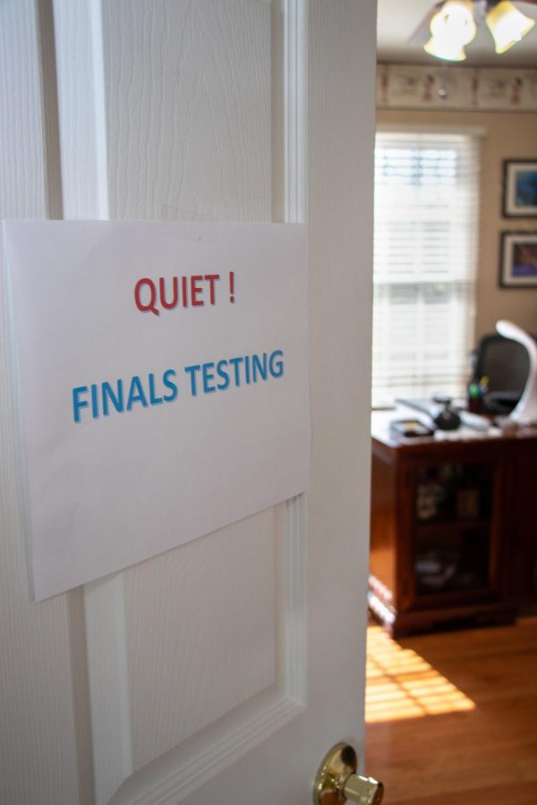 a bedroom door with a sign reading Quiet! Finals Testing