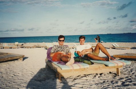 Anderson and hake laying on the beach