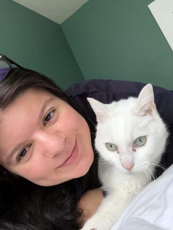 female student with white cat