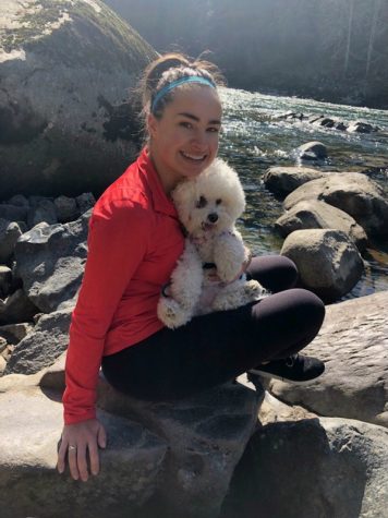 student with her dog on a nature hike