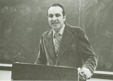 Professor Cammarosano at a podium in front of a chalkboard