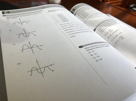 an SAT test practice book displaying graph problems