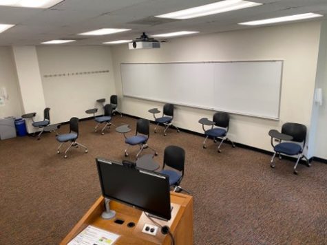 A Lowestein classroom set up for social distancing with only 9 desks, all at least 6 feet apart