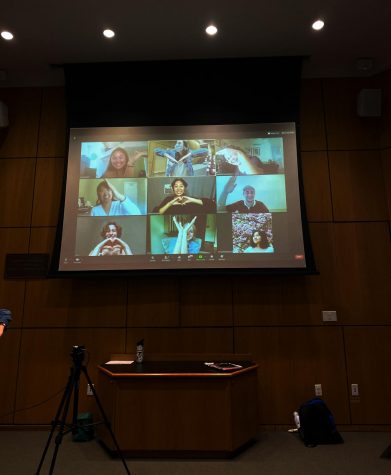 group of students on orientation zoom making a heart with their hands