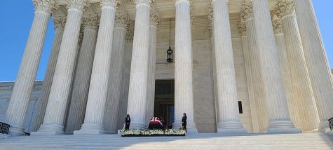 Ruth Bader Ginsburg in a coffin on the front of the Supreme Court building