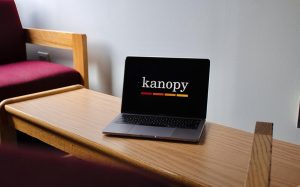 a laptop sits on a dorm bench with the movie streaming site kanopy onscreen