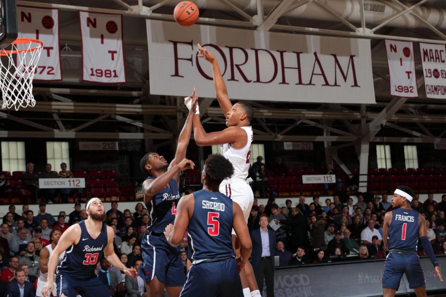 fordham+basketball+player+making+a+layup+on+a+basketball+court