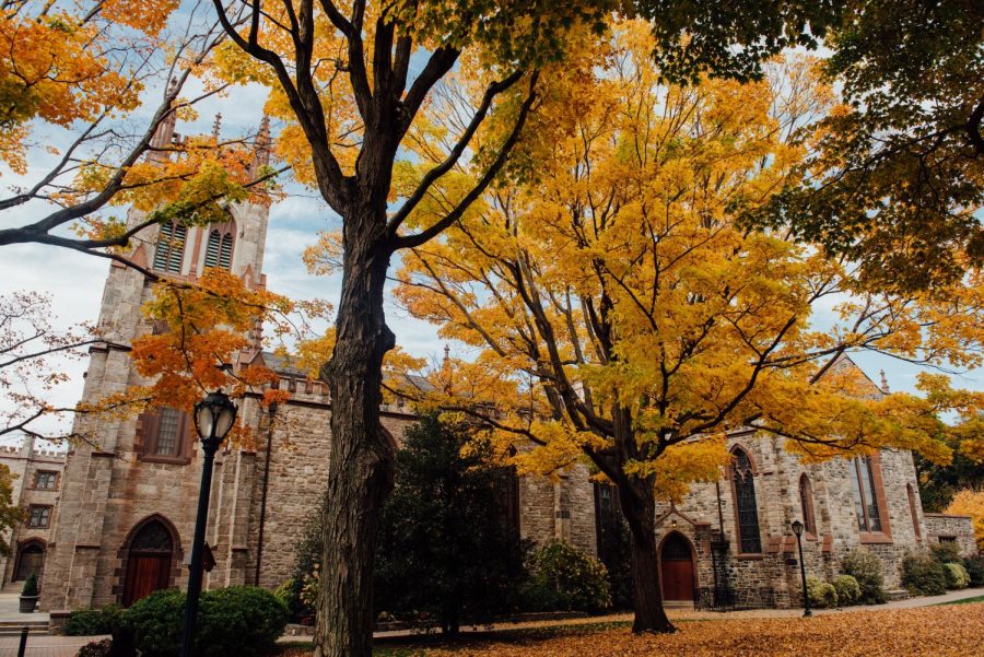 the university church viewed from the side with trees in fall colors in the foreground