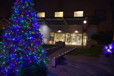 The Christmas tree with lights in front of the 140 West building