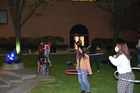 Students dancing in the hula hoops on the plaza