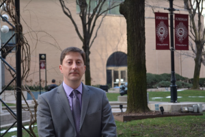 new dean of student services Keith Eldredge poses on the Outdoor Plaza
