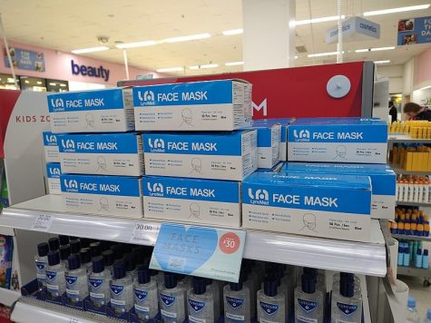 face masks on a shelf in a UK pharmacy
