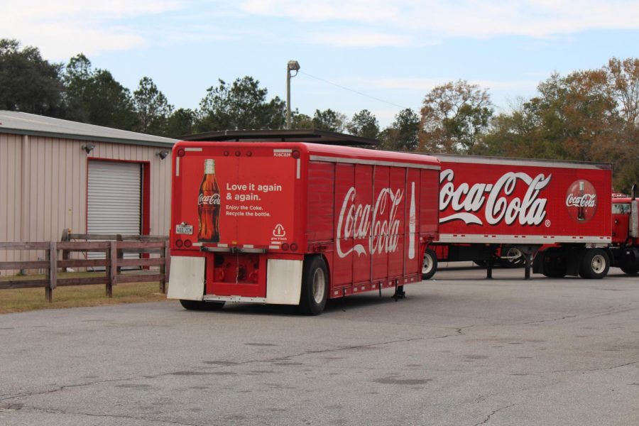 Coca+Cola+trucks+parked+in+a+lot