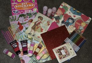 photo of pink and red craft supplies for an article about valentine activities