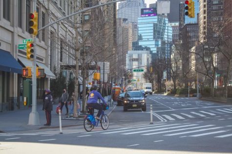 photo of cyclist on the new york street in spring
