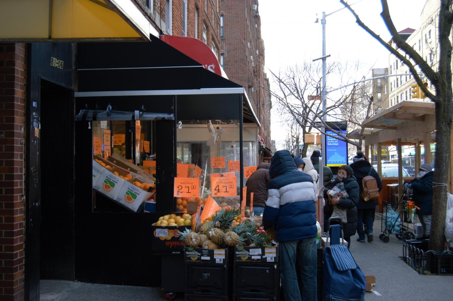 person shopping for produce in jackson heights