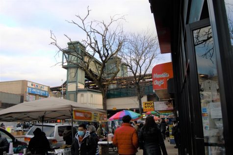 sidewalk and the 7 train in jackson heights