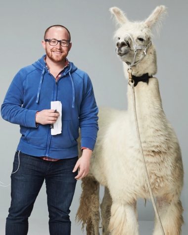 Craig Calefate poses with a llama on set